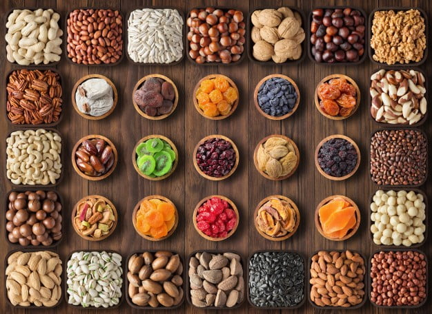 assorted nuts dried fruits wooden table top view healthy snack bowls food background 84485 430 - Manvik Foods benefits of eating nuts and seeds